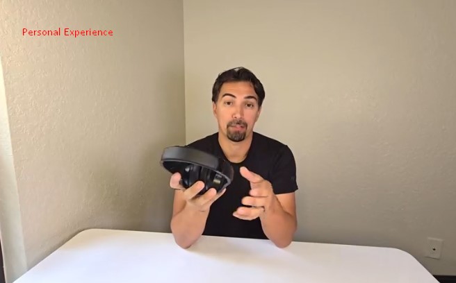 Man holding folded Soundcore Q20i headphones and gesturing while sharing his personal experience