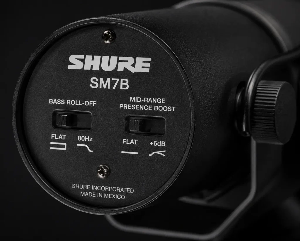 Close-up of the Shure SM7B rear panel showing its bass roll-off and mid-range presence boost switches